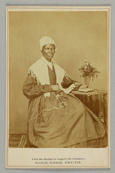 Truth sold cartes-de-visite and cabinet cards, such as this one, to raise money for her work. The text above her name reads "I Sell the Shadow to Support the Substance." In this image, she is seated, knitting, wearing a shawl and bonnet, and wire-rimmed glasses. By Adam Cuerden - Collection of the Smithsonian National Museum of African American History and Culture, Object Number 2013.207.1, CC0, https://commons.wikimedia.org/w/index.php?curid=115455214