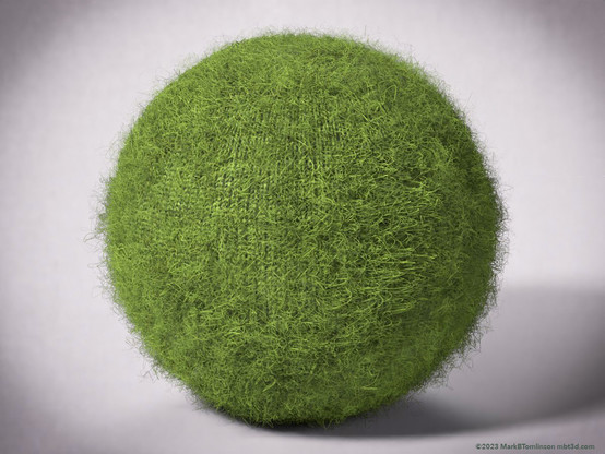 A green woollen ball model of a fury ball.