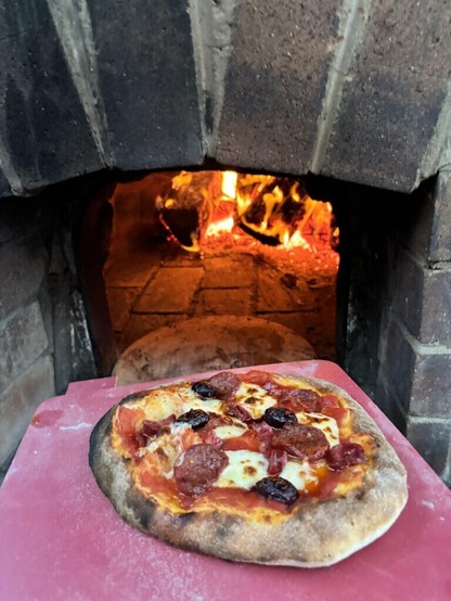 Moved into a new house with a pizza oven, fired it up for the first time last night and this is what we got :)