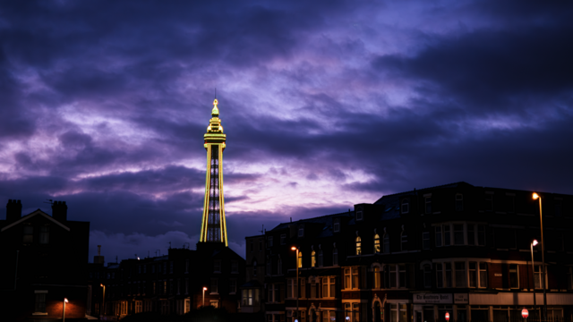 This is a photo of the Blackpool Tower, framed against a purple sky as the last of blue hour fades away into darkness.