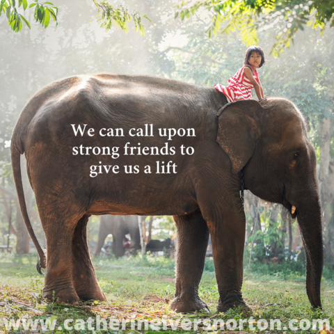 A girl in a colorful dress sits atop a giant elephant. The caption reads, "We can call upon strong friends to give us a lift."
