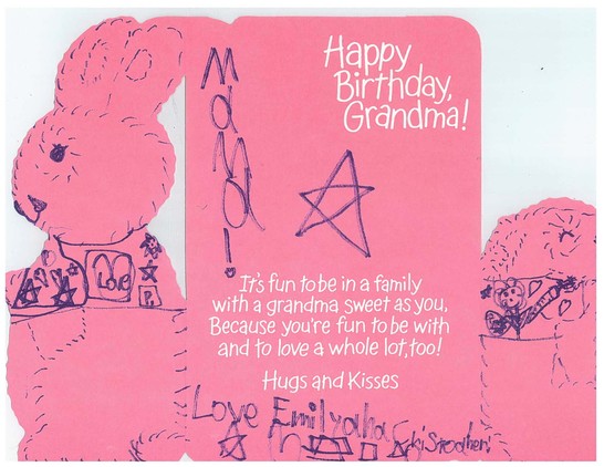 Image of the inside of a birthday card from grandchildren to their grandmother. The pages are pink, and drawn over by many images by the children.