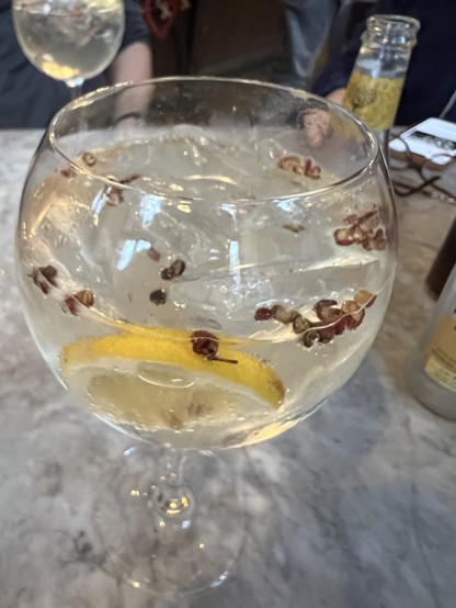 A gin and tonic with bits of lavender.