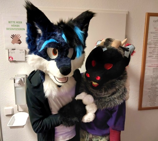 A nice shot showing me and the derg, both in suit, hugging each other, while looking into the camera.