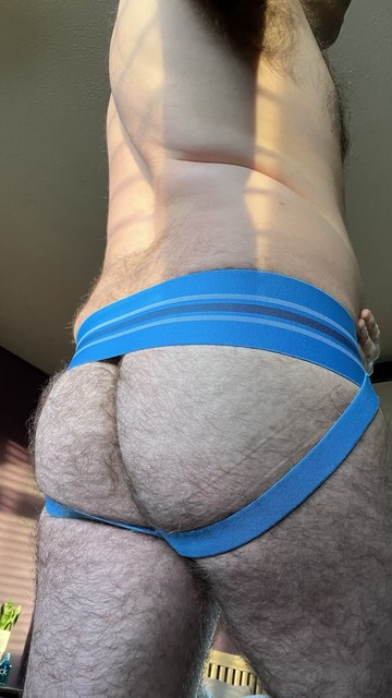 Hairy gay guy showing off his ass in a blue Arjun Kross wide waistband jockstrap
