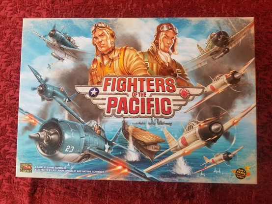 Box cover of Fighters of the Pacific,  featuring many airplanes and two high-cheekboned pilots.