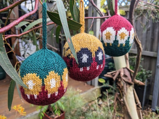 Knitted baubles with sheep motifs