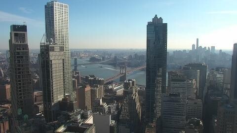 This webcam usually shows a view of skyscrapers with Brooklyn Bridge in the background. It's a clear day. It's 46ºF/8ºC.