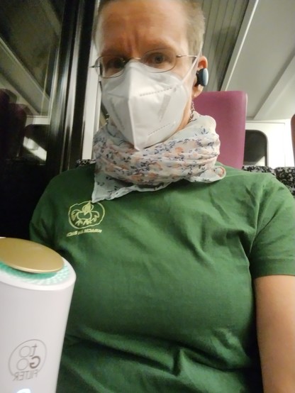 Me with a ffp2 mask and air purifier togo on a train
