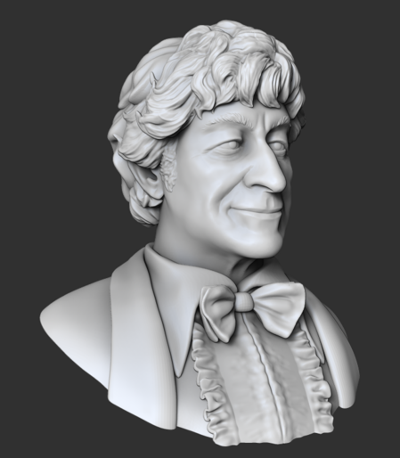 Partially finished digital sculpt of a bust of the Third Doctor (Pertwee). The hair is not completely finished, shhh.  No color, just light grey material on a deep grey background