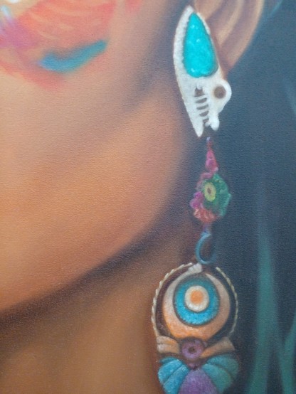 a close-up of her jaw, neck, and earring