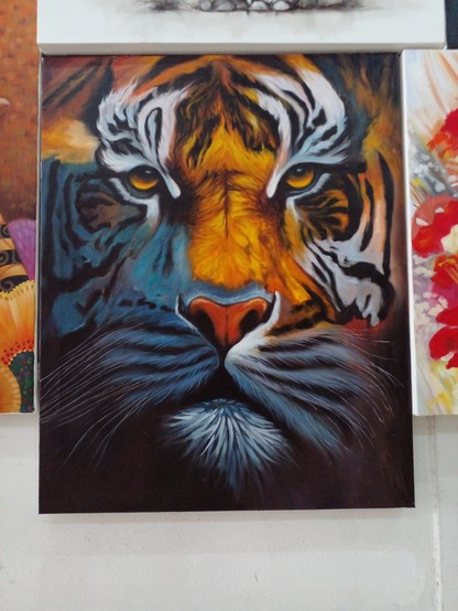 a painting of a tiger's face, looking at the viewer, dark background