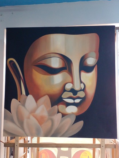 a painting of the Buddha's face with a large lotus flower in placed in the bottom right , the flower is white and light gold, the Buddha's face gold, his eyes closed, seen from his right side, the background is black