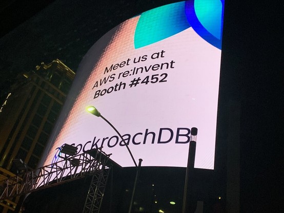Image of AWS re:Invent digital billboard sign in Las Vegas, USA. It faces onto the 'Strip' boullevard in Las Vegas and its a nightime shot.