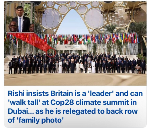 Photograph of the national leaders at COP28 with Rishi Sunak on the back row and the caption: "Rishi insists Britain is a 'leader' and can 'walk tall' at Cop28 climate summit in Dubai... as he is relegated to back row of 'family photo' "