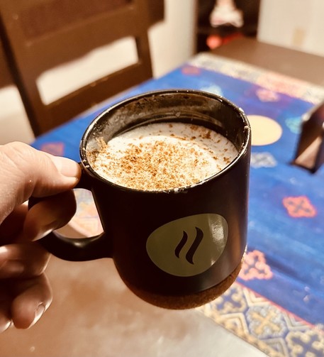 A cup of homemade cappuccino with powdered canela on top