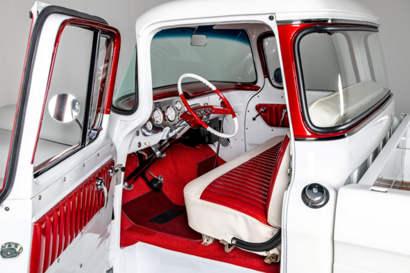 the door is open, the interior of the truck is red and white