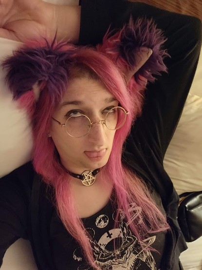 Me laying in a hotel bed.  Ahegao face I guess.