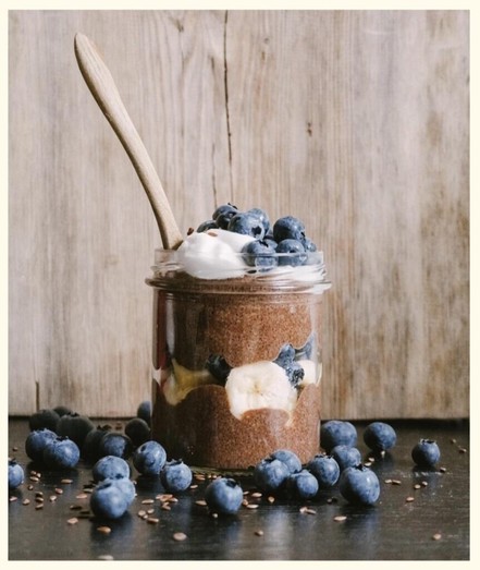 Flaxseed chocolate pudding with fruits and berries and vegan whipped cream