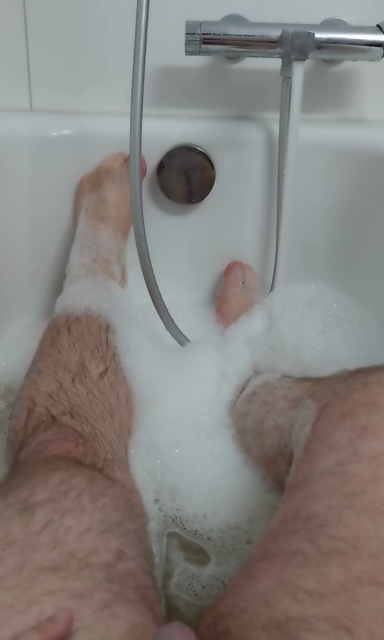 Video of me in the bathtub, visibly cold, peeing all over my legs and a bit over my penis and balls