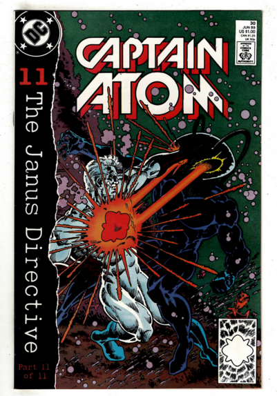 a cover of a comic book, in the upper left corner there is the dc comics logo in black on white, there is a strip down the left border that says '11 - The Janus Directive' , at the top center is the title 'captain atom' in white and red, the illustration is of captain atom and black manta locked in battle at the bottom of the ocean, captain atom grabbing his large helmet head, black manta is blasting him with lasers from his eyes