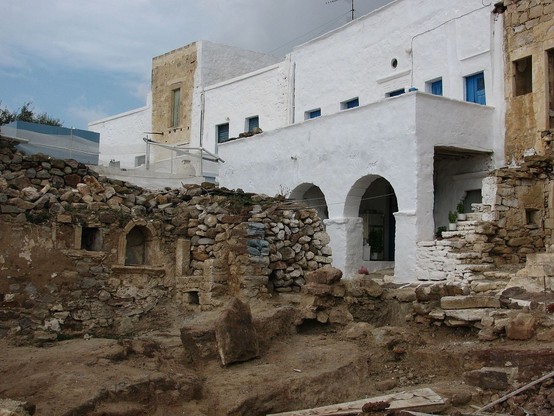 a photo of the cool old foundations and the white newer buildings next to them