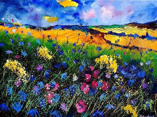 Bright colourful painting of a landscape with mainly orange and yellow fields in the background, and a lot of blue, pink and yellow flowers in the foreground of the painting. Directly behind the flowers is a green field. The fields in the background have touches of blue, green and brown to them. The sky is painted in various shades of blue, with touches of pink, purple and yellow in it.