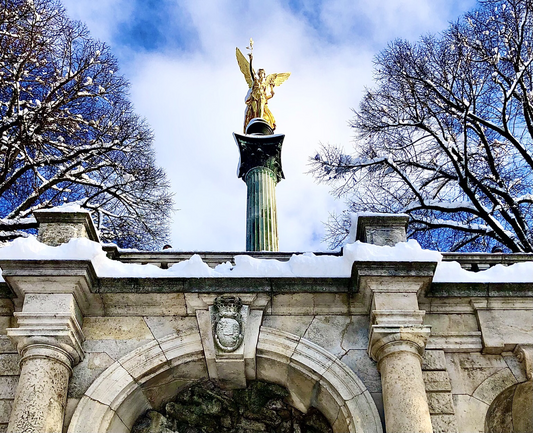 The Angel of Peace atop a column, covered in snow, at Munich’s Friedensengel