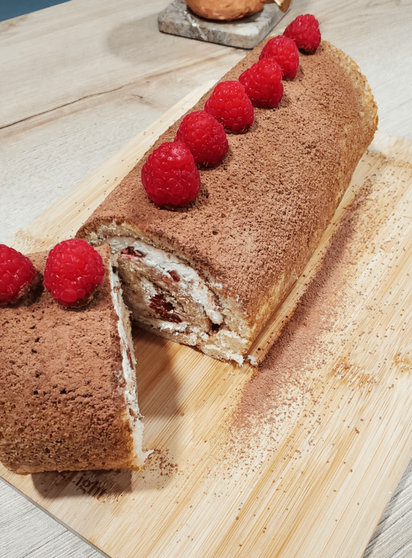 Tiramisu cake roll with fresh raspberry. (Made by me)