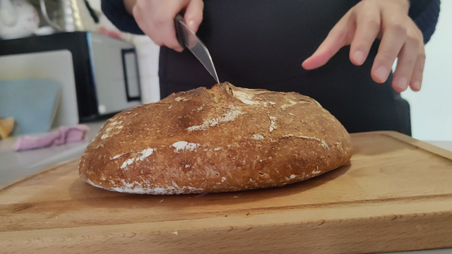 My first ever sourdough and crumbshot! 50/50 wheat/spelt, 70 % hydration.