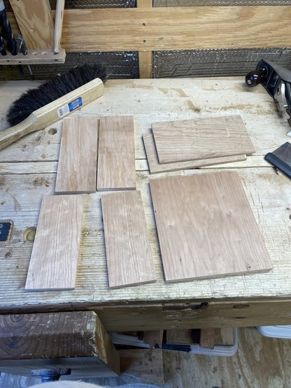 Small pieces of cherry wood lying on a workbench.