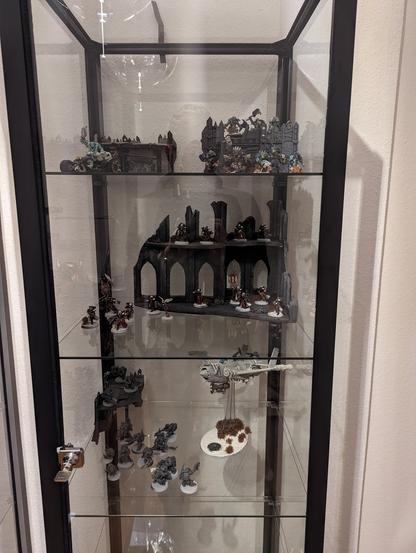 The right glass cabinet houses Orks and Sisters at the moment.