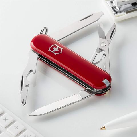 Product image of a red Victorinox Rambler 58 mm Swiss Army Knife, containing penknife, nail file/screwdriver, scissors, and caplifter/screwdriver.