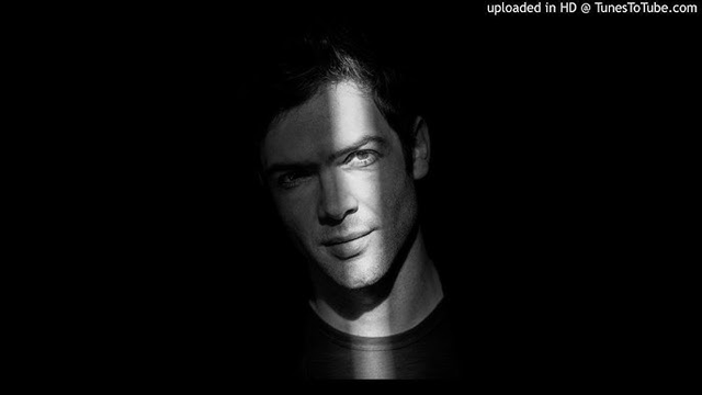 Ethan Peck with his face half covered in shadow