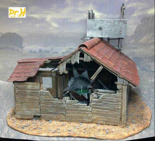 Side of the example wooden hut. with a damaged wall from an explosion.