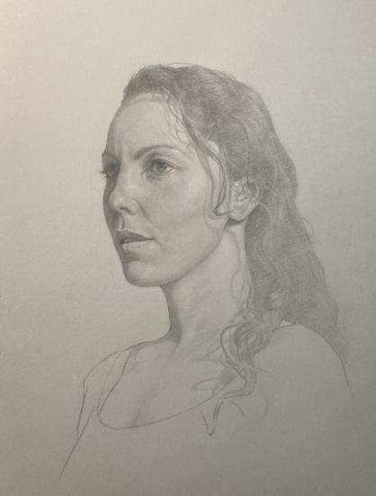 Portrait of young woman in graphite on grey background with chalk highlights.