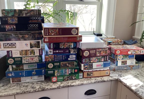 Our laundry room counter has 4 large stacks of puzzle boxes.  There are over 30 boxes of different size puzzles, front 250 pieces to 2,000 pieces.