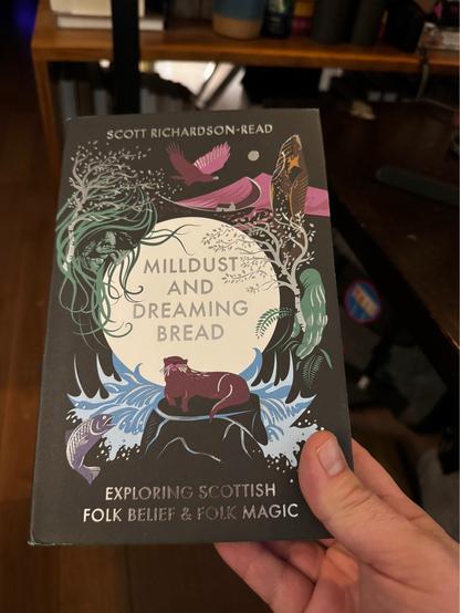 Picture of a book titled “mill dust and dreaming bread, exploring Scottish folk belief and folk magic” by Scott Richardson-Read. The cover has birds, otters and salmon