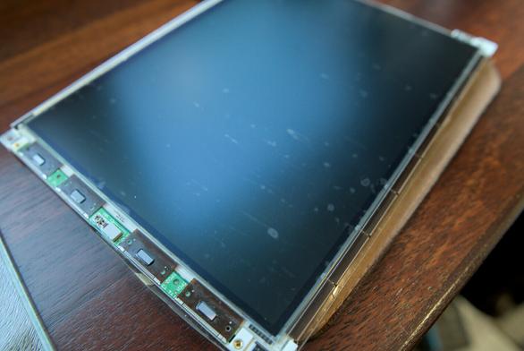 Photo showing the new polarizing filter attached with a bunch of substantially sized bubbles and streaks showing. This attempt utterly failed.