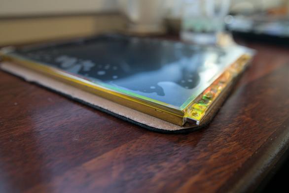 Another photo of another angle, showing more Kapton tape holding the other sides of the polarizing filter in place.