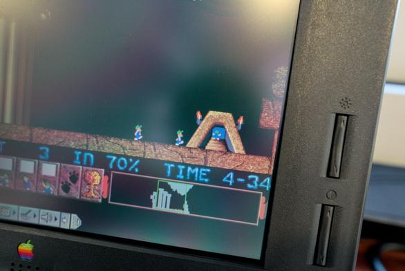 Close-up photo of the bottom right corner of the display, showing two lemmings approaching the level's ending and a third one in the middle of walking up its steps. Finer details of the display can be seen well in this photo, showing its pixels look crisp and clean, or as clean as can be expected from a 30 year old display. Technically it could look a small amount clearer still if I had succeeded in directly attaching the filter to the display, but it's surprisingly good looking as-is.