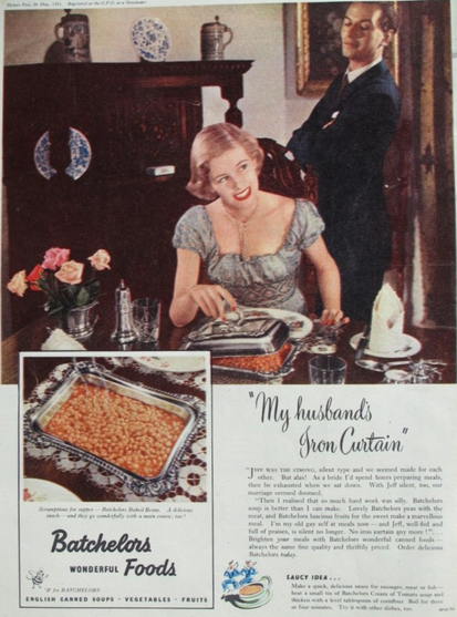 Woman opens a chafing dish to reveal baked beans