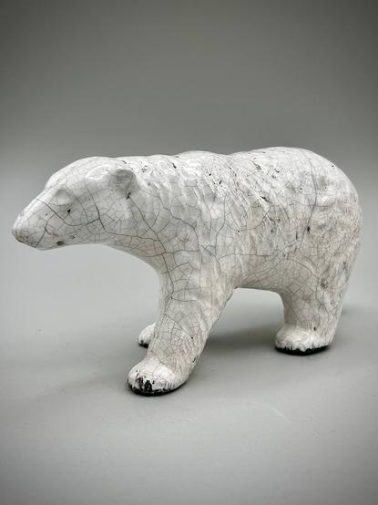 A white raku bear with distinctive crackles