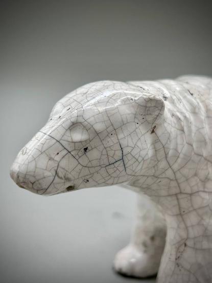 A white raku bear with distinctive crackles, face closeup