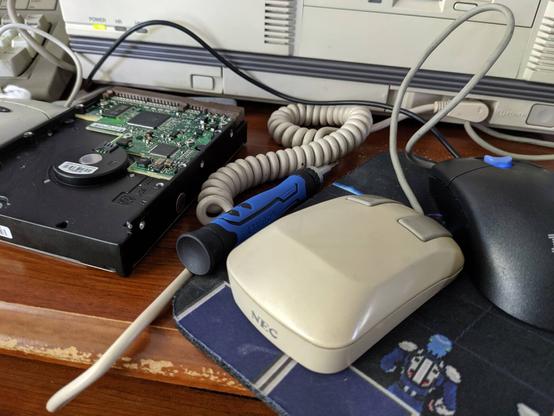 Outside of mouse, looks like any other late PC-9801/early 9821 mouse. Old NEC logo.