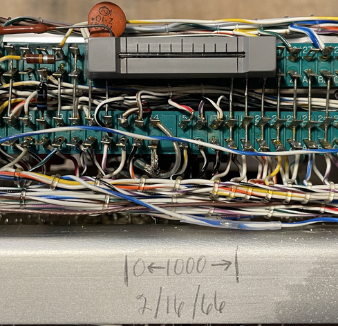 A close-up of the elapsed time indicator. A grey block or plastic approximately 1” long with a slender glass tube down the side. As this tube changes color along it’s length, it indicates the time in use.
