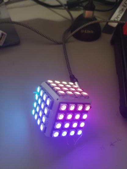 4x4 LED matrix cube with 4x4 panels displaying adafruit neopixel demo code, at least one of the panels is upside down.
a small ESP32C3 board is used as the microcontroller.
The 5x5 half cube was scaled down 25% and the 4x4 panels almost fit correctly at after that.