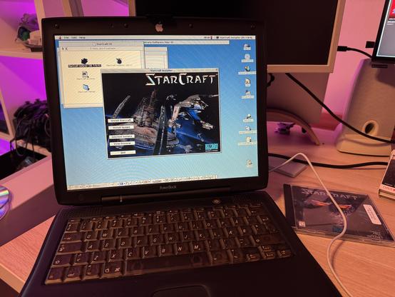 A black Apple PowerBook running thru StarCraft installer.