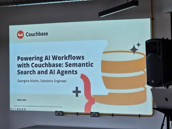 a photo of the title slide of the talk:  Powering AI Workflows with Couchbase: Semantic Search and AI Agents