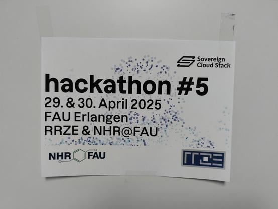 Sign that reads "hackathon #5" with the dates and the location.